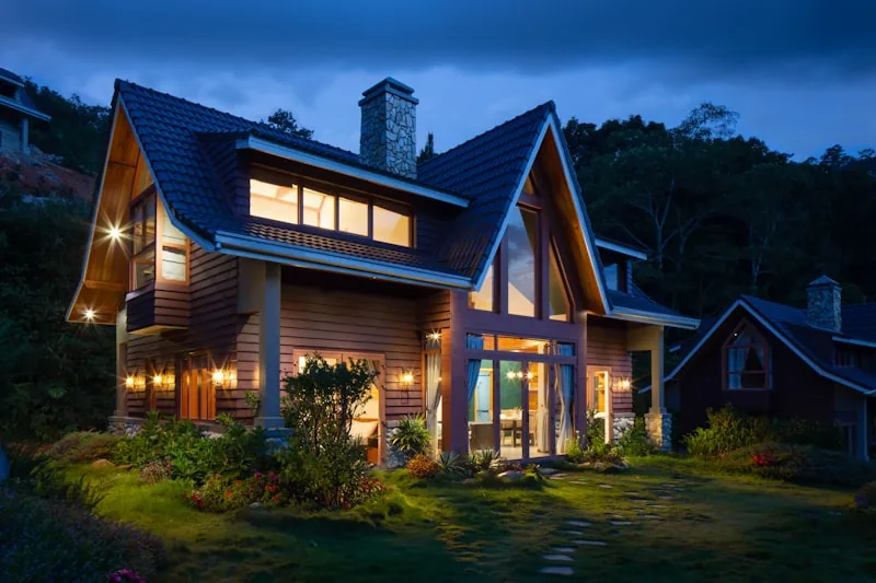 Family home lit up at dusk
